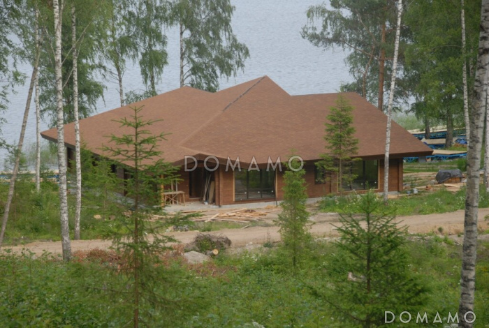 Проект дома из клееного бруса с просторной террасой площадью более 100 кв.м.