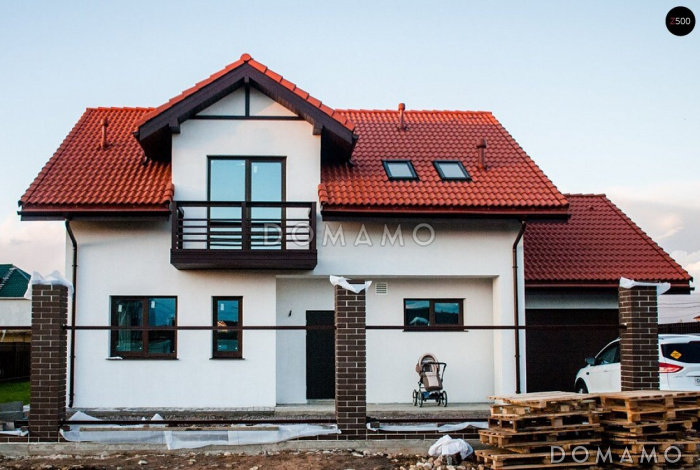 Проект одноэтажного мансардного дома из газобетона с кабинетом, эркером и балконом