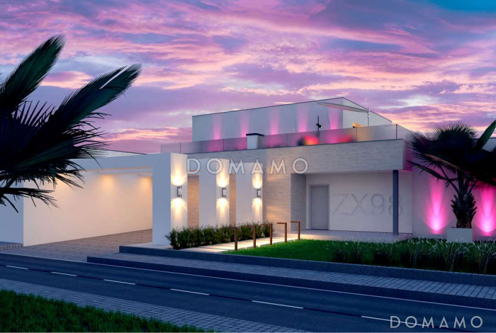 Проект современного двухэтажного дома из газобетона с плоской крышей необычного дизайна, с большими террасами на обоих уровнях, подходит для участка со склоном