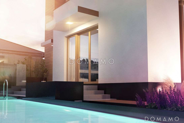 Проект современного комфортного двухэтажного дома из газобетона для двух семей с квартирами на разных этажах и общим гаражом с двумя въездами