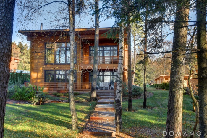 Проект двухэтажного дома из клееного бруса с сауной и гостевой комнатой на первом этаже