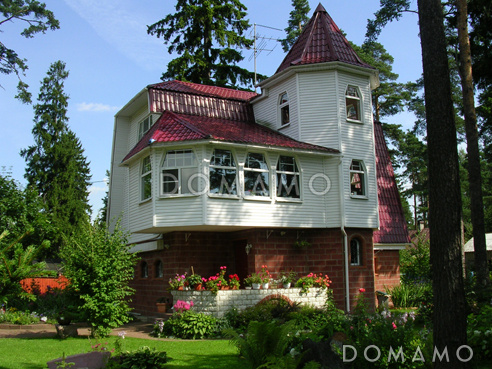 Проект коттеджа с зимним садом и гаражом