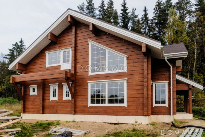 Проект деревянного дома из клееного бруса с большой совмещенной гостиной с кухней