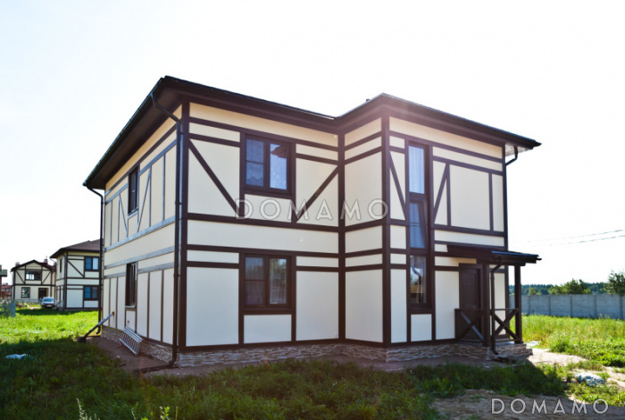 Проект двухэтажного дома из пеноблоков в стиле фахверк