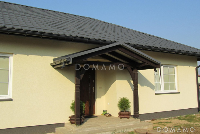 Проект компактного одноэтажного дома из газобетона с двумя спальнями и боковой террасой 