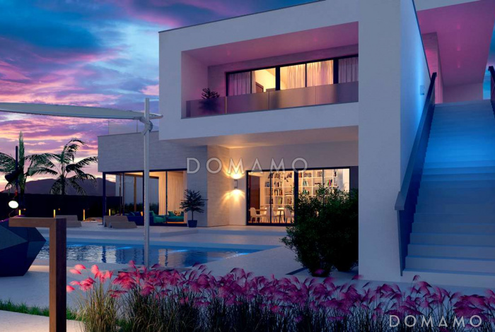 Проект современного двухэтажного дома из кирпича с плоской крышей необычного дизайна, с большими террасами на обоих уровнях, подходит для участка со склоном